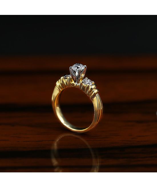 Classic Three-Stone Yellow Gold Engagement Ring features center 0.50ct